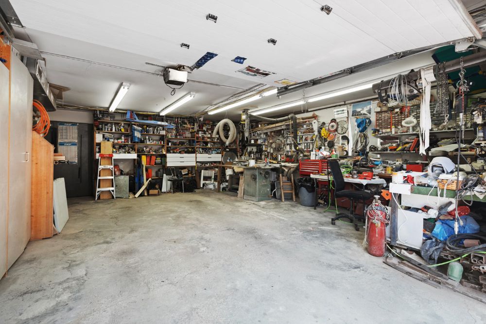 A busy garage displaying numerous tools and items, representing an indoor junk removal service in San Francisco, CA.